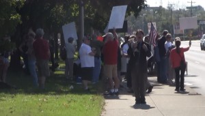 Chris Irwin of Knoxville stands in front of "125 counter-protesters." More like a few dozen.